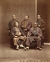 Five Japanese men in traditional formal robes, two seated, three standing