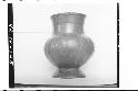 Plumbate standard jar on annular base, gadrooned. Ma.x ht. 14.3cm., max. diam. 1