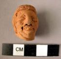 Pottery figurine head - human