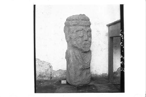 Front and right profile of stone figure