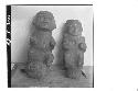 Front of 2 small stone figures