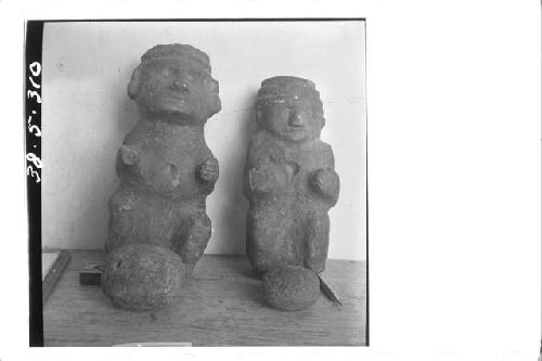 Front of 2 small stone figures