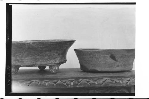 Two black ware dishes with incised designs