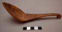 Curved wooden spoon