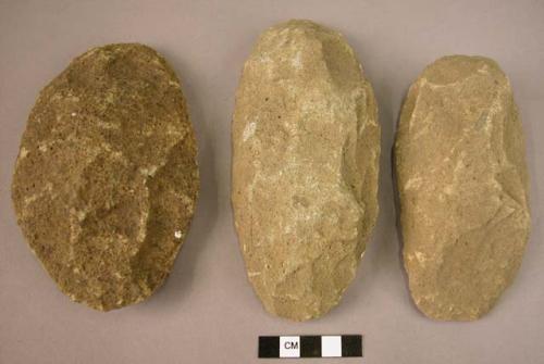 Large stone axes made on flat river pebbles chipped on one side only