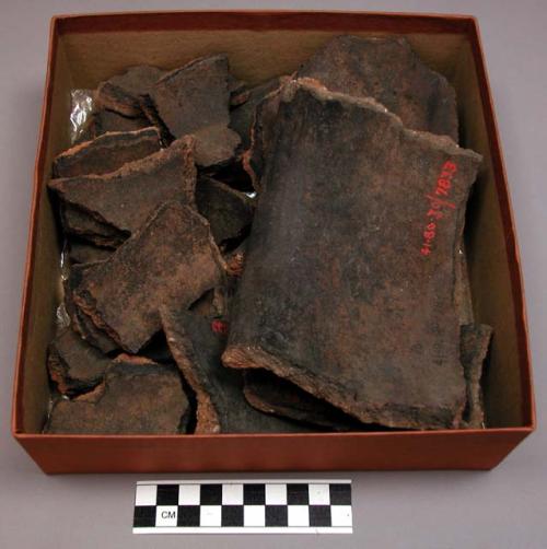 Broken earthenware pot (19 sherds); fire blackened