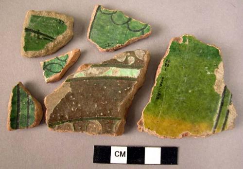 Ceramic body sherds, green and brown glazed ware, black filled incised designs