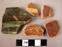 Ceramic rim and body sherds, brown and yellow; black and green glazed int.