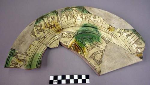 Partially restored pottery plate fragment- Persian Sgraffito