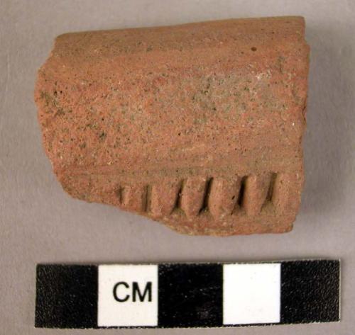 Rim potsherd - red-brown, incised