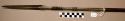 Spear, long barbed point and neck, incised decoration, wood shaft