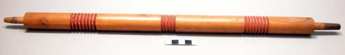 Pipe stem, round, 3 bands carved ridges, red pigment