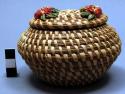 Coiled basket (A) with flowered lid (B)