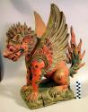 Wooden carving of Singha winged lion - symbol of spiritual power