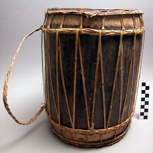 Small drum - held on feet and played at same time as 37-98-70/846