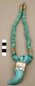 Necklace of turquoise and silver beads with bear-claw shaped pendant