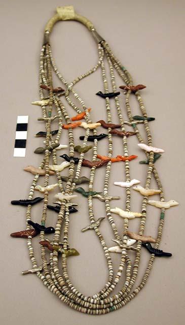 Necklace of 4 strands of bird fetishes & heishi, silver cones & beads at top