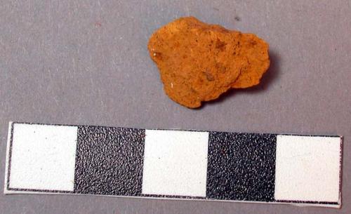 Raw material, yellow mineral fragment.