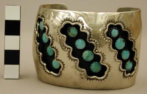 Wide silver cuff bracelet, partially hollow with strips of inlaid turq. stones