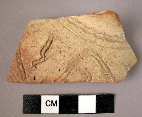 Potsherd - light colored, buff slip, incised