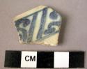 Rim potsherd - blue on white glaze