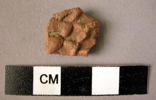 Potsherd - red-brown, molded