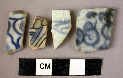 4 potsherds - blue on white glaze