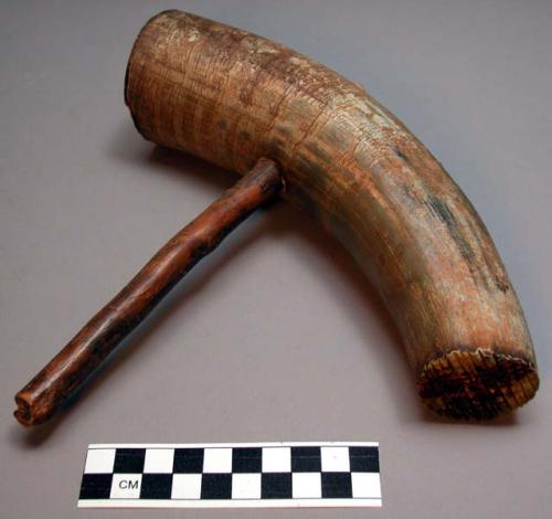 Hammer of wood and cow horn for bark cloth.  Mwango