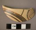 Small Mycenean imported potsherd, thin ware, white slip with spiral arc in red