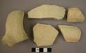 Ceramic rim, body and handle sherd, light ware w/ thin white slip, undecorated