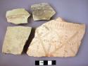 Ceramic rim and body sherds, white slipped, 1 incised and impressed