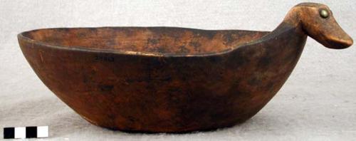 Wooden bowl, flat base, carved bird handle, brass tacks for eyes