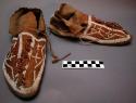Pair of Sioux moccasins. Hard soles w/ leather uppers.