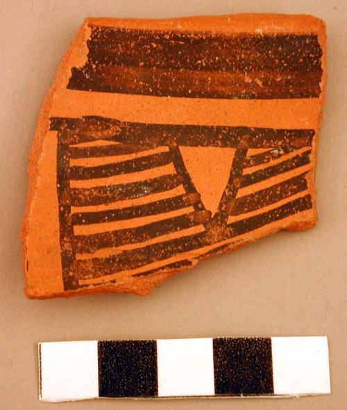 Redware ceramic rim sherd, painted geometric design