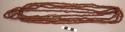 String of hand carved wooden beads, 4 strands