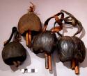 Leg rattles, palm nut with 2 wood clappers, leather attachment, lele