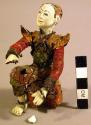 Kneeling pottery doll - painted and clothed