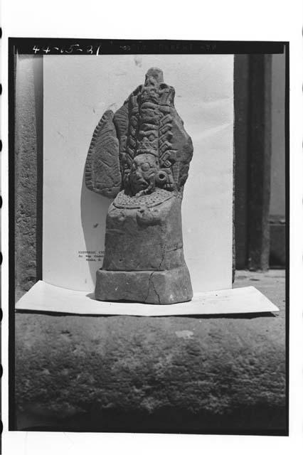 Another view of 44-11-27 [Pottery figurine.  Bearded (artificial) head with supe