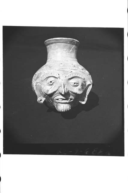 Plumbate "old man" effigy jar