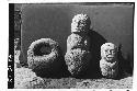 3 objects at left "manopla" of stone. Others two crude stone statues