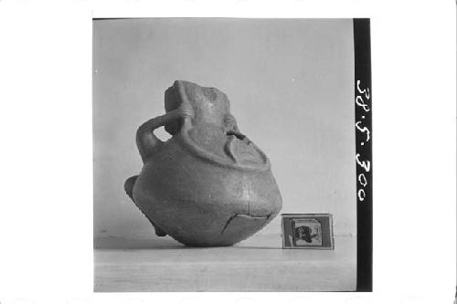 Human effigy pot with spout (back & left side)