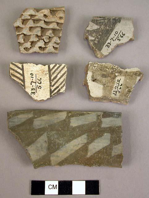 Potsherds with black-on-white design inside and corrugated outside