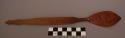 Spoon, carved wood, pointed ladle with relief design, incised designs on handle