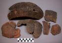 Ceramic sherds, some partially reconstructed, brown, rough exterior