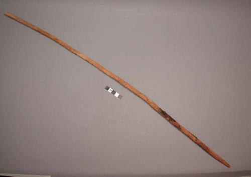 Wood, Prayer stick, pointed at one end, with painted stripe.