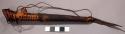 Whistle, tubular piece of wood, half of length wrapped in mongoose skin, fibre a