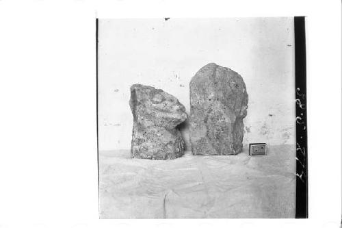 Right profile of two stone figures