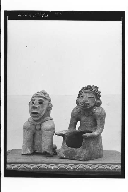 Two pottery idols of "Zoque" type.  Both with chin straps.  One on right has lea