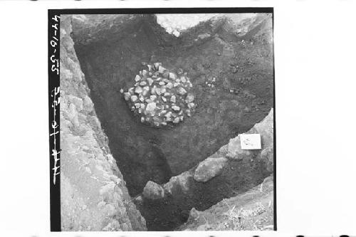 Fire-pit 44-2, viewed from SW and above.  Small stones mixed with charcoal.  pos