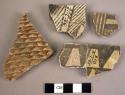 Potsherds from bowls with black-on-white deocration inside, corrugated outside